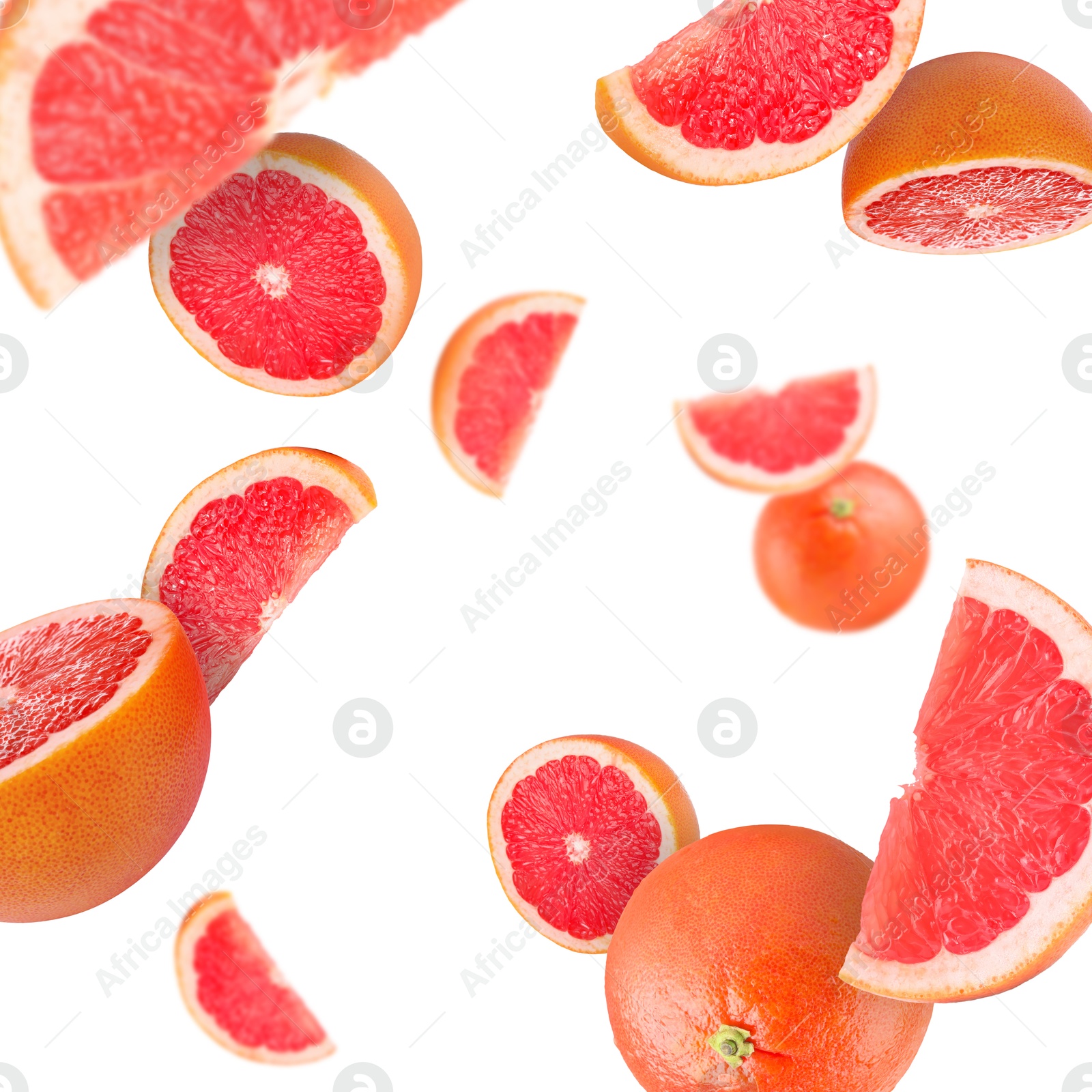 Image of Fresh grapefruits swirling in air against white background