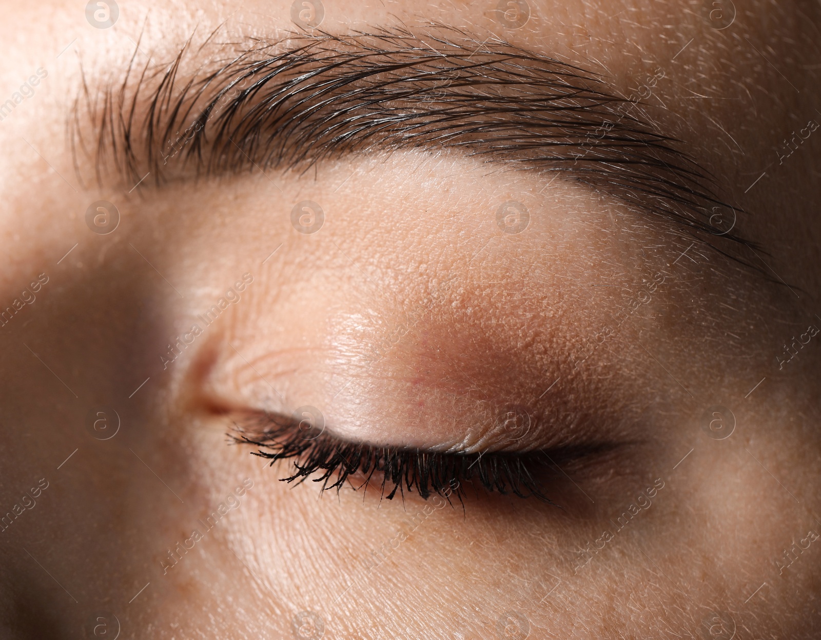 Photo of Eyebrow styling. Young woman with beautiful eyebrow, closeup