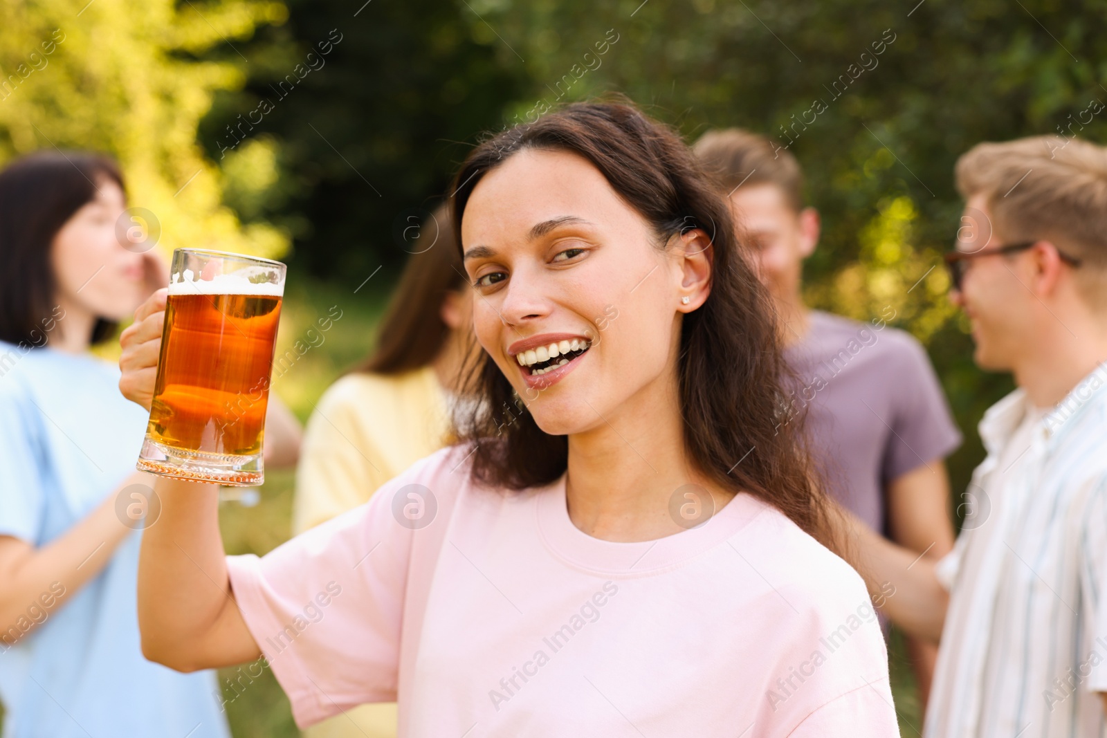 Group of happy friends having fun and drinking beer outdoors, selective focus Photo of Group of happy friends having fun and drinking beer outdoors, selective focus