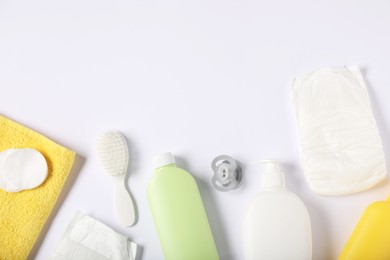 Photo of Baby accessories and cosmetic products on white background, flat lay. Space for text
