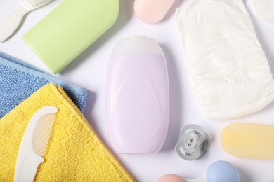 Photo of Baby accessories and cosmetic products on white background, flat lay