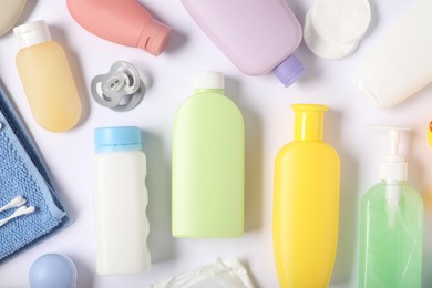Photo of Baby accessories and cosmetic products on white background, flat lay