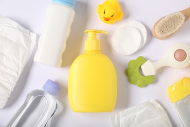 Photo of Baby accessories and cosmetic products on white background, flat lay