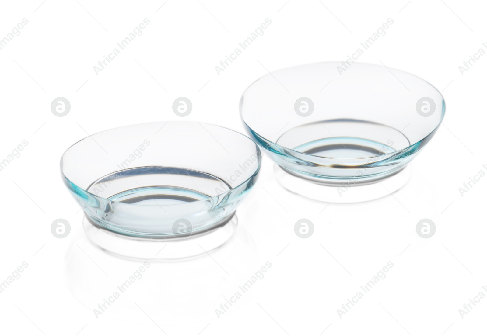 Pair of contact lenses isolated on white Photo of Pair of contact lenses isolated on white