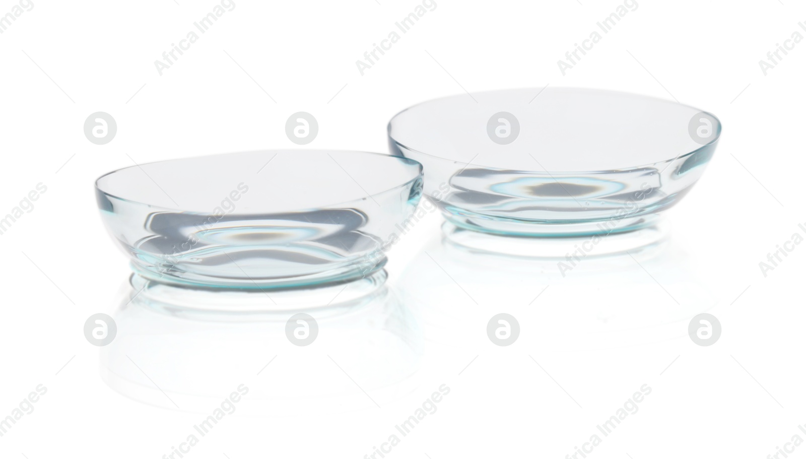 Pair of contact lenses isolated on white Photo of Pair of contact lenses isolated on white