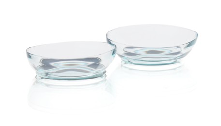 Photo of Pair of contact lenses isolated on white