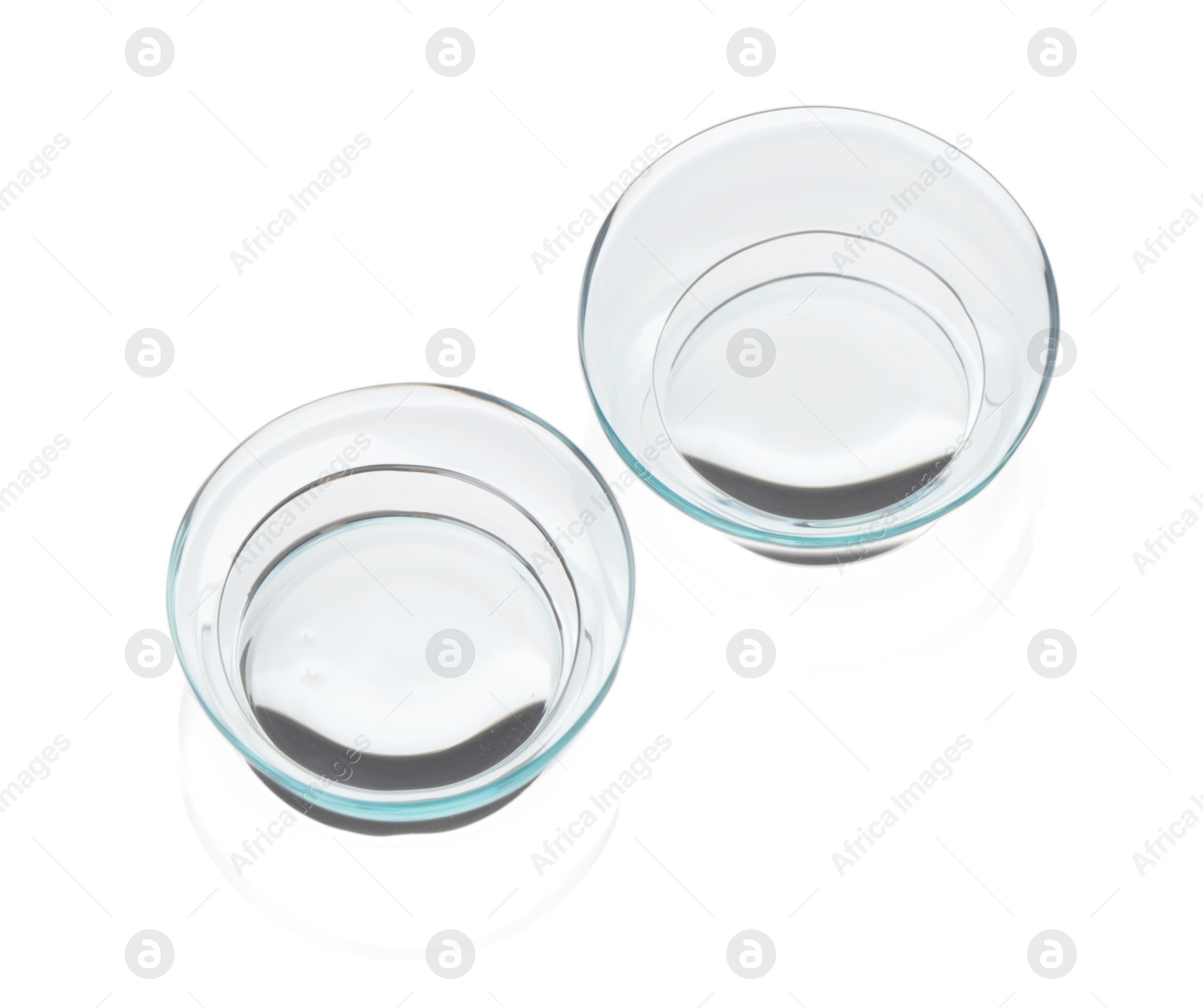 Pair of contact lenses isolated on white, above view Photo of Pair of contact lenses isolated on white, above view