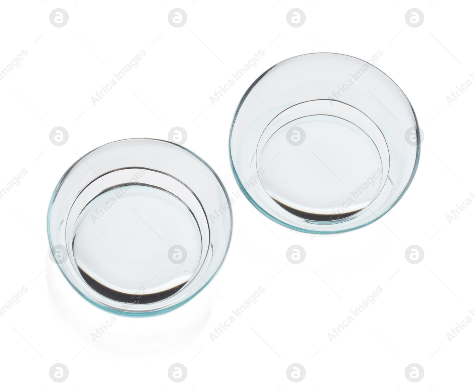 Pair of contact lenses isolated on white, top view Photo of Pair of contact lenses isolated on white, top view