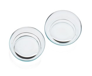 Photo of Pair of contact lenses isolated on white, top view