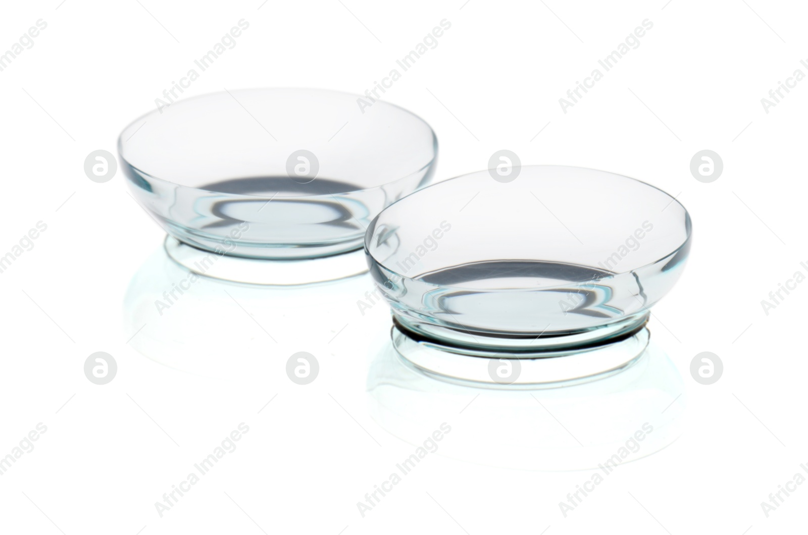 Pair of contact lenses isolated on white Photo of Pair of contact lenses isolated on white