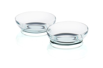 Photo of Pair of contact lenses isolated on white