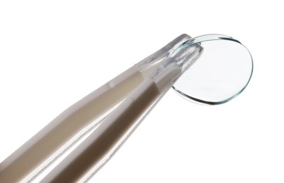 Photo of Tweezers with contact lens isolated on white