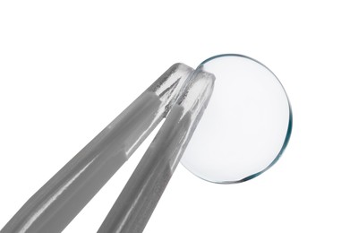 Photo of Tweezers with contact lens isolated on white