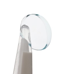 Photo of Tweezers with contact lens isolated on white