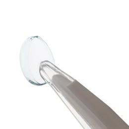 Photo of Tweezers with contact lens isolated on white