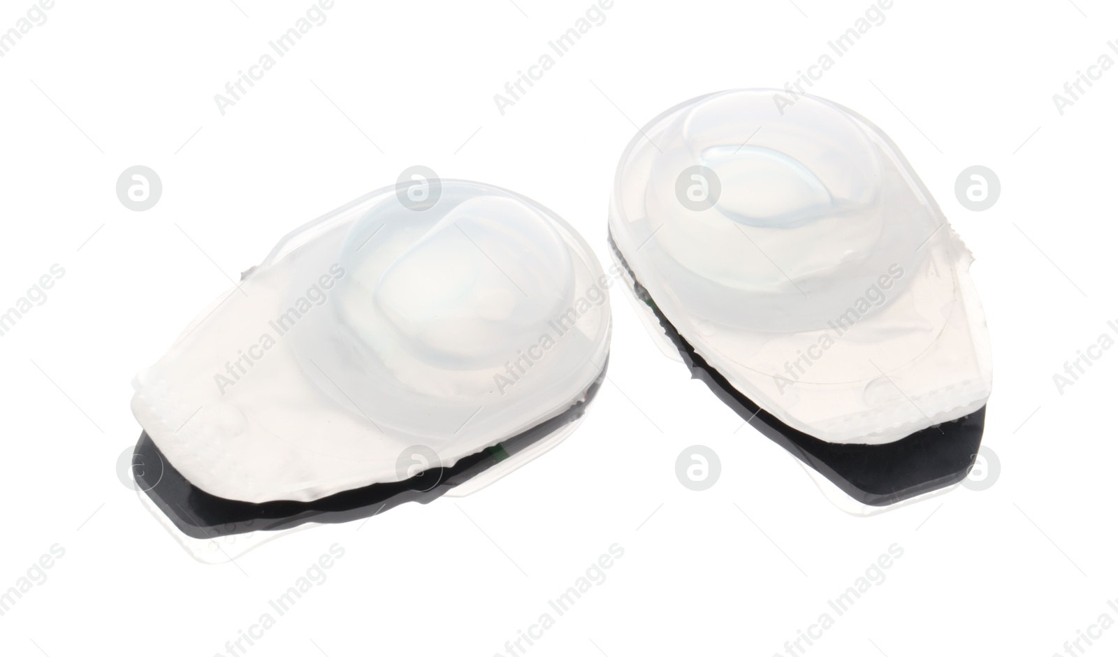 Photo of Blister packs with contact lenses isolated on white