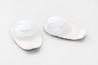 Photo of Blister packs with contact lenses on white background