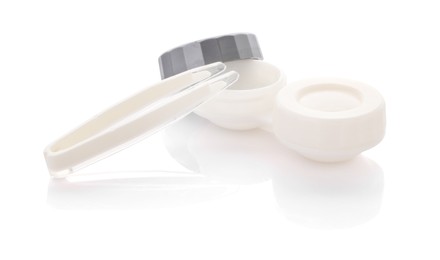 Photo of Case with contact lenses and tweezers isolated on white
