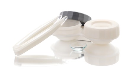 Photo of Case with contact lenses and tweezers isolated on white