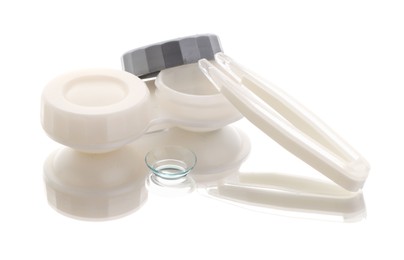 Photo of Case with contact lenses and tweezers isolated on white