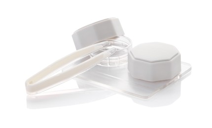 Photo of Case with contact lenses and tweezers isolated on white