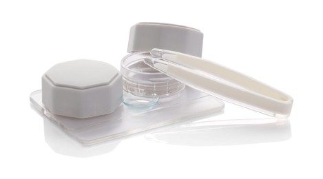 Photo of Case with contact lenses and tweezers isolated on white