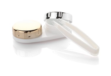 Photo of Case with contact lenses and tweezers isolated on white