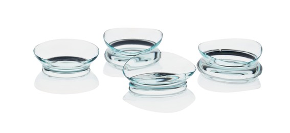 Photo of Many transparent contact lenses isolated on white