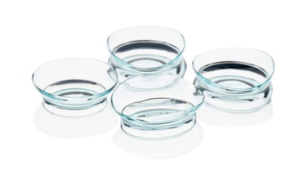 Photo of Many transparent contact lenses isolated on white
