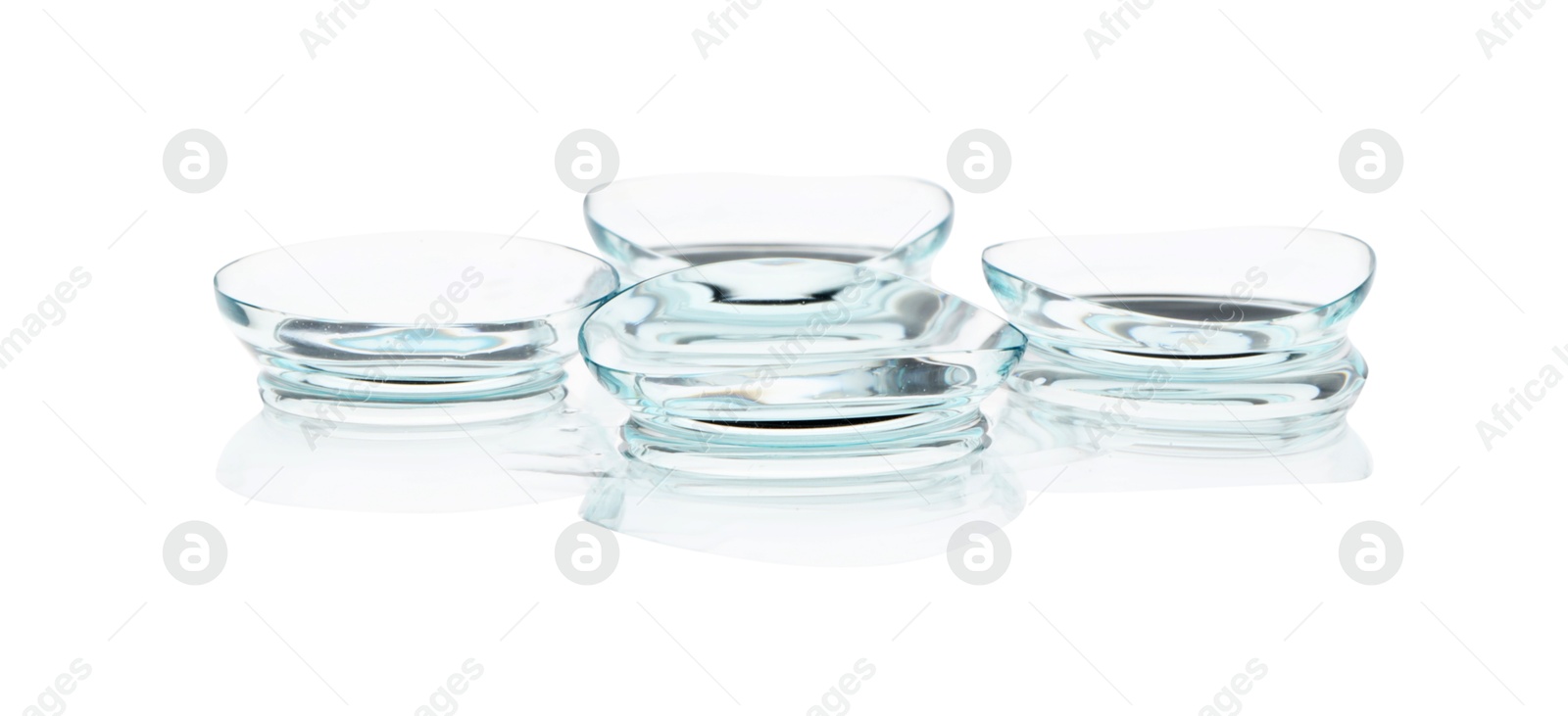 Many transparent contact lenses isolated on white Photo of Many transparent contact lenses isolated on white