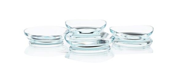 Photo of Many transparent contact lenses isolated on white