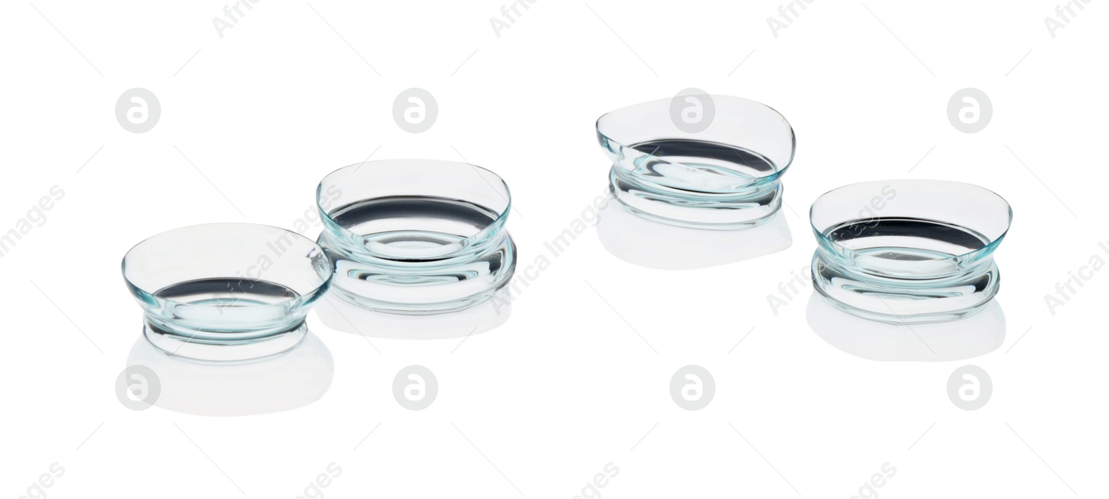 Many transparent contact lenses isolated on white Photo of Many transparent contact lenses isolated on white