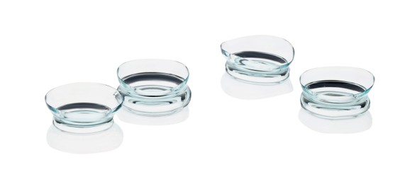 Photo of Many transparent contact lenses isolated on white