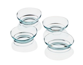 Photo of Many transparent contact lenses isolated on white