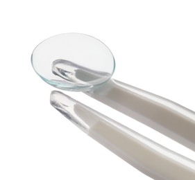 Photo of Tweezers with contact lens isolated on white