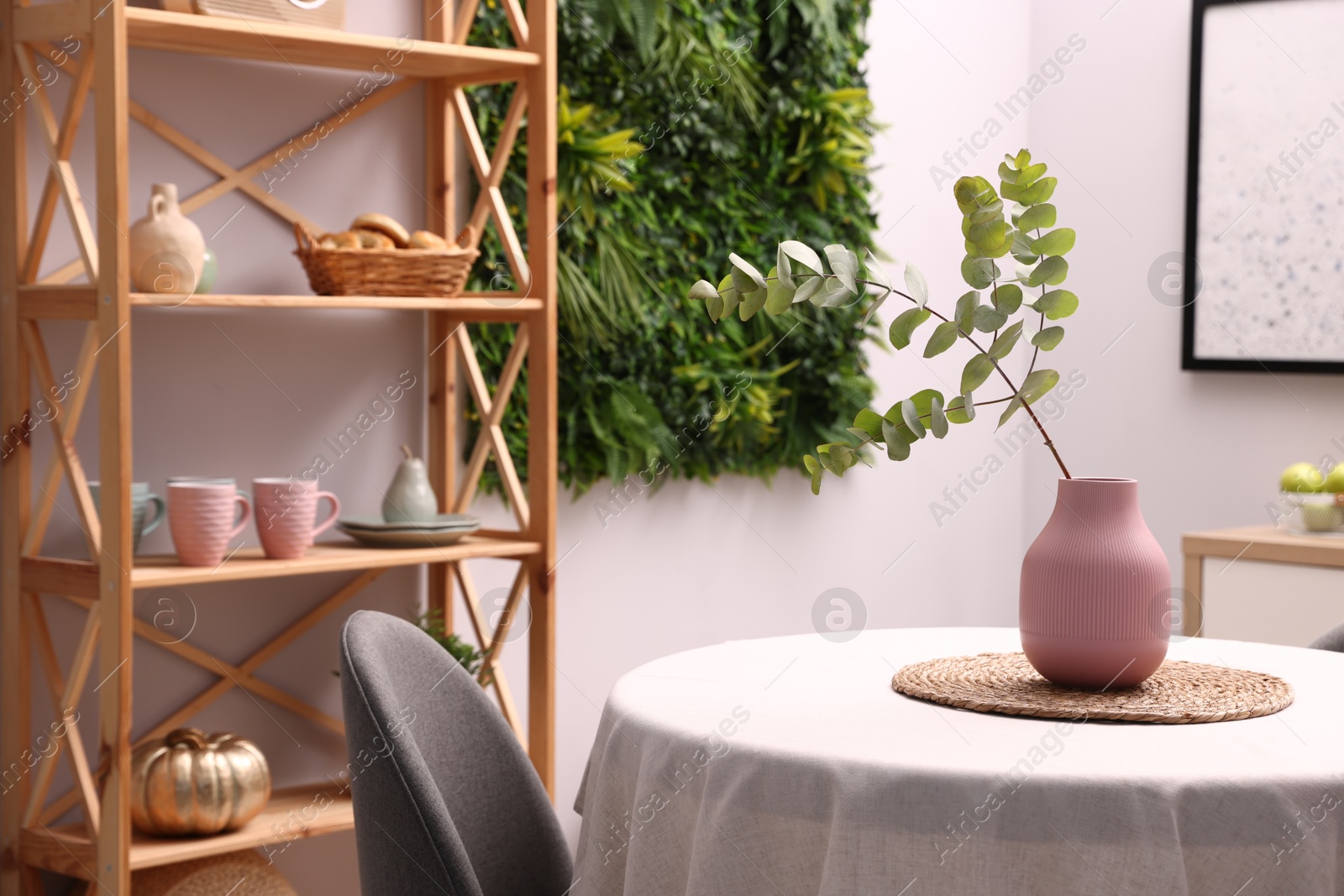 Stylish table with chair and decor in dining room. Interior design Photo of Stylish table with chair and decor in dining room. Interior design