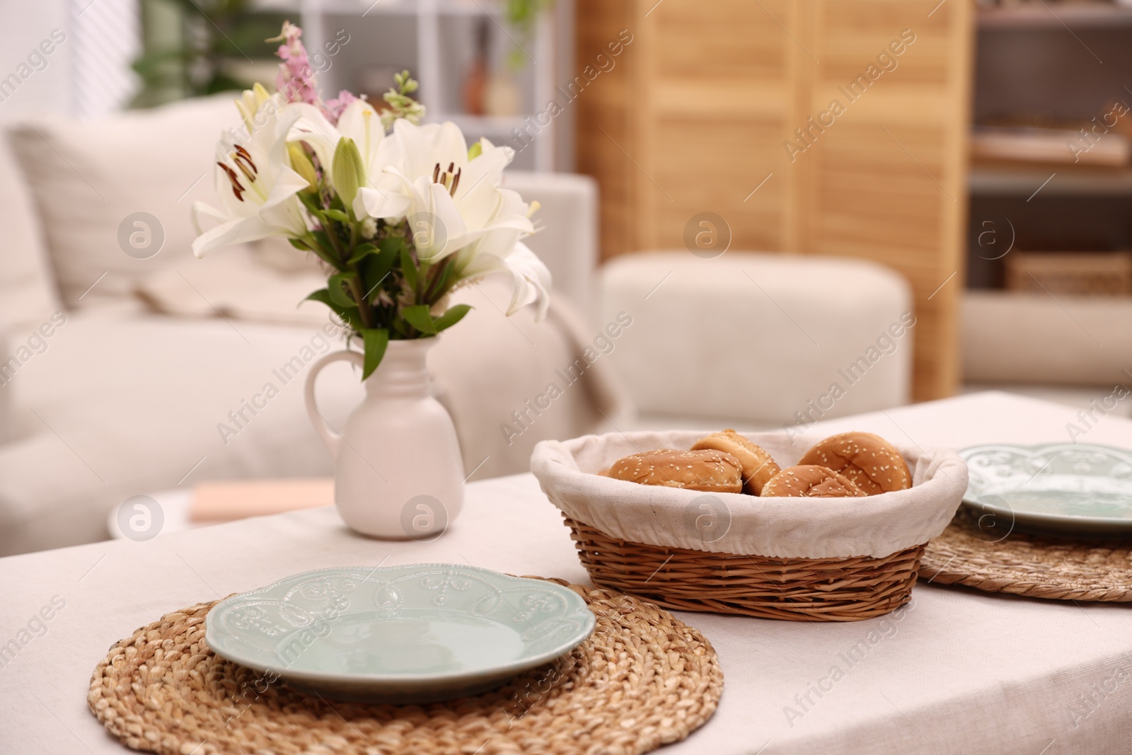 Stylish table setting and decor in dining room, closeup. Interior design Photo of Stylish table setting and decor in dining room, closeup. Interior design