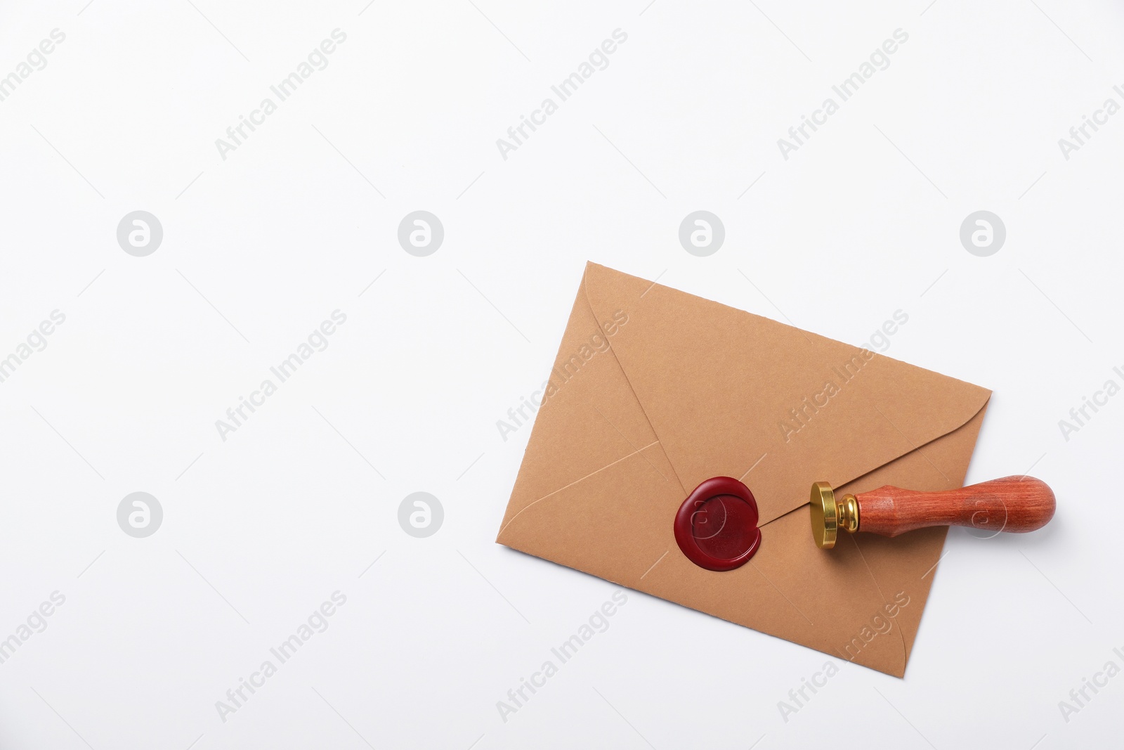 Envelope with wax seal and stamp on white background, top view. Space for text Photo of Envelope with wax seal and stamp on white background, top view. Space for text