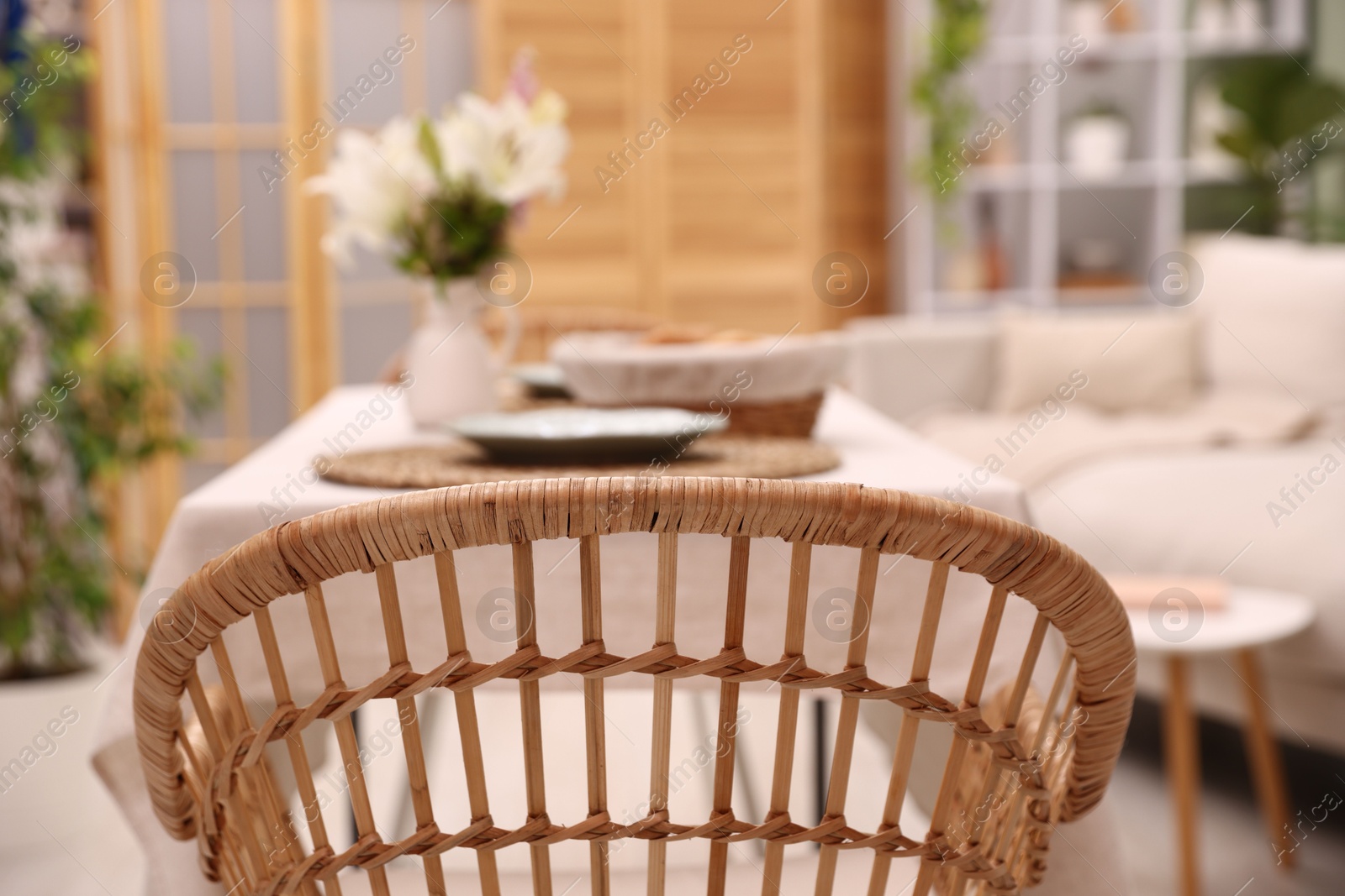 Stylish table with chair and decor in dining room, selective focus. Interior design Photo of Stylish table with chair and decor in dining room, selective focus. Interior design