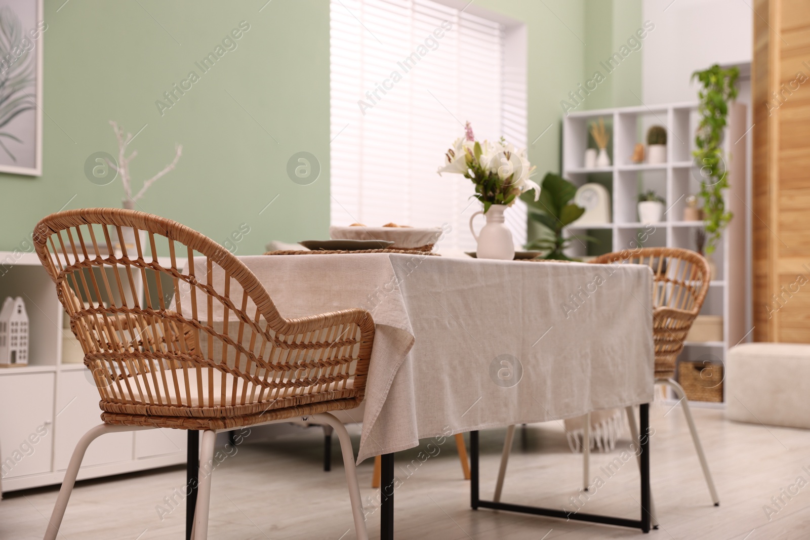 Stylish table with chair and decor in dining room. Interior design Photo of Stylish table with chair and decor in dining room. Interior design