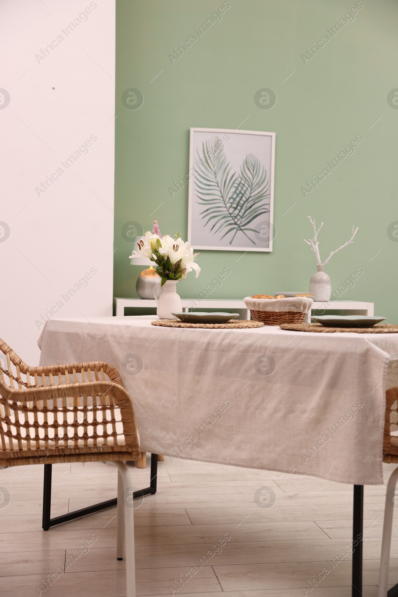 Stylish table with chair and decor in dining room. Interior design Photo of Stylish table with chair and decor in dining room. Interior design
