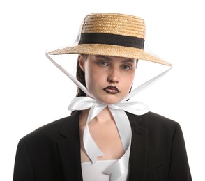 Photo of Beautiful young woman with black lip liner wearing straw hat on white background
