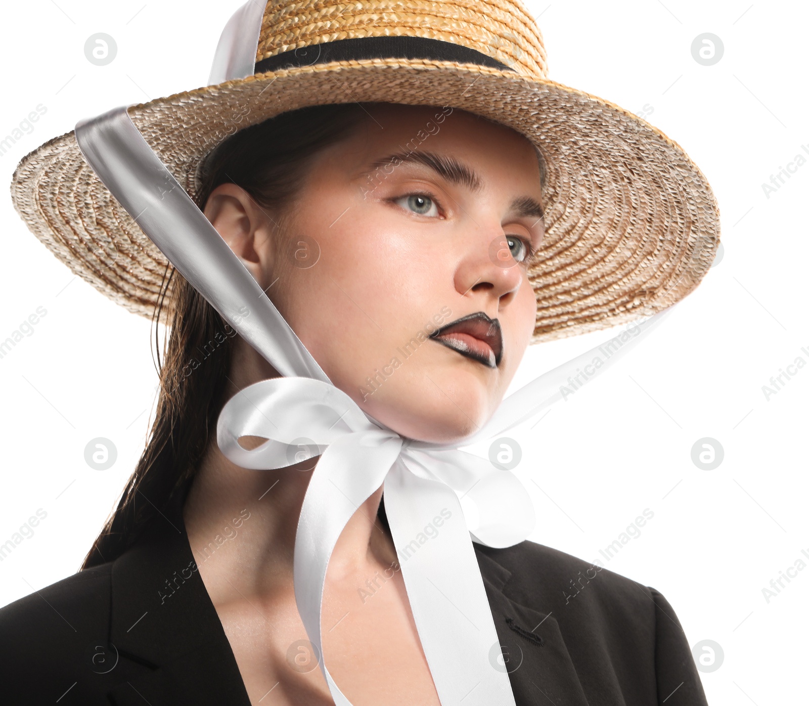 Photo of Beautiful young woman with black lip liner wearing straw hat on white background