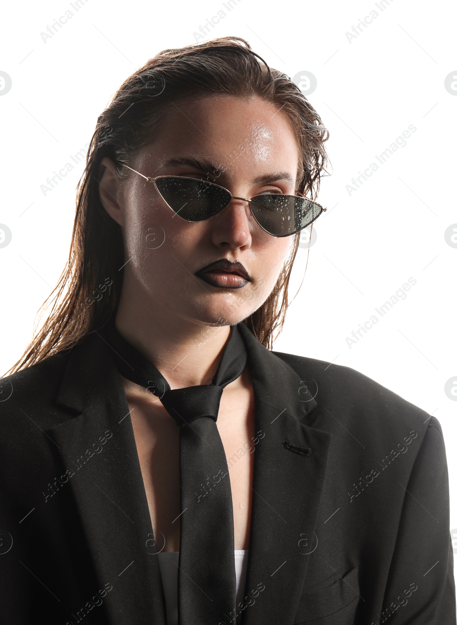 Photo of Beautiful young woman with black lip liner wearing wet sunglasses on white background