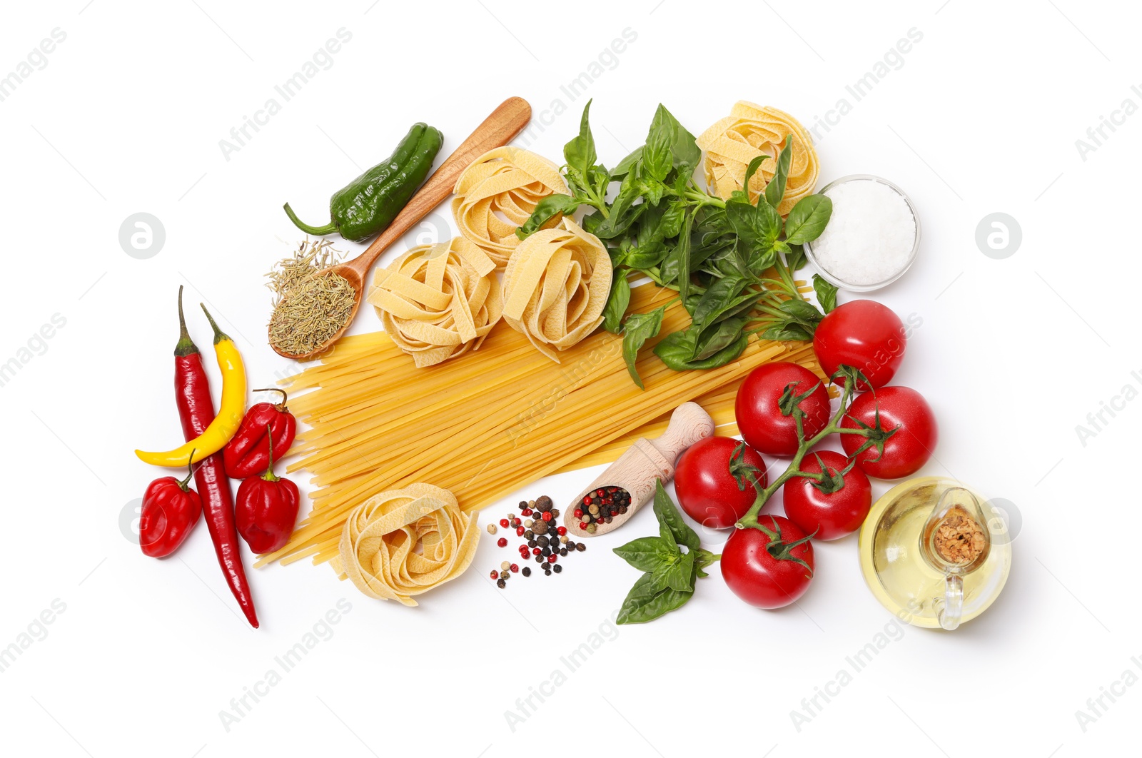 Photo of Different types of pasta and ingredients isolated on white, top view