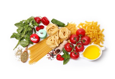 Photo of Different types of pasta and ingredients isolated on white, top view