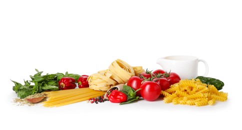 Photo of Different types of pasta and ingredients isolated on white