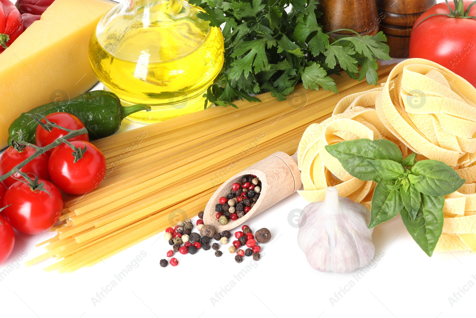 Photo of Different types of pasta and ingredients isolated on white