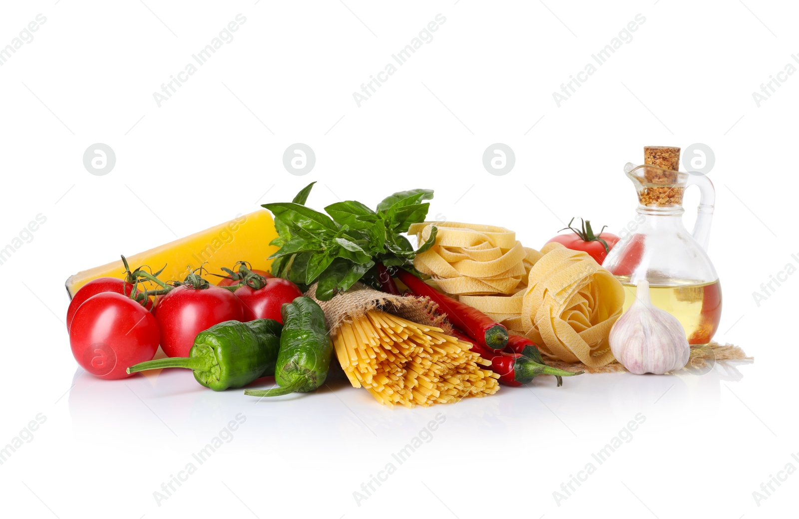 Photo of Different types of pasta and ingredients isolated on white