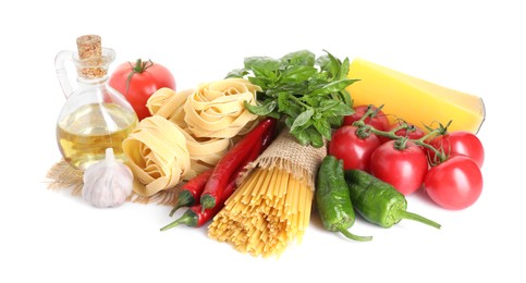 Photo of Different types of pasta and ingredients isolated on white